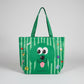 Green tote bag with a cartoon dog design on a white surface
